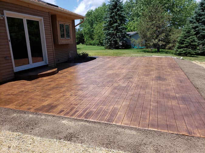 A house with a large patio in front of it