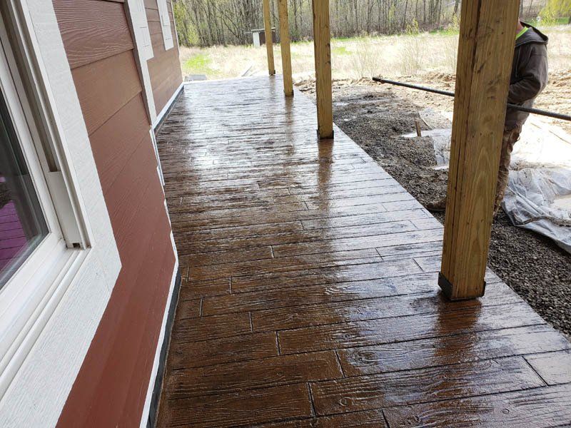 A brick walkway is being built in front of a house.