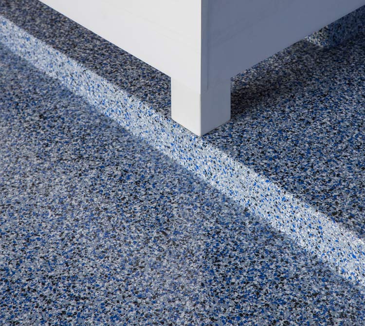 A blue and gray floor with a white line on it