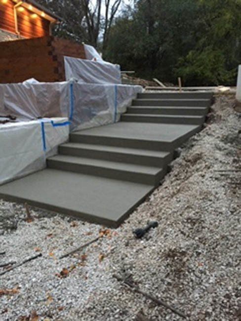 A set of concrete steps going up a hill