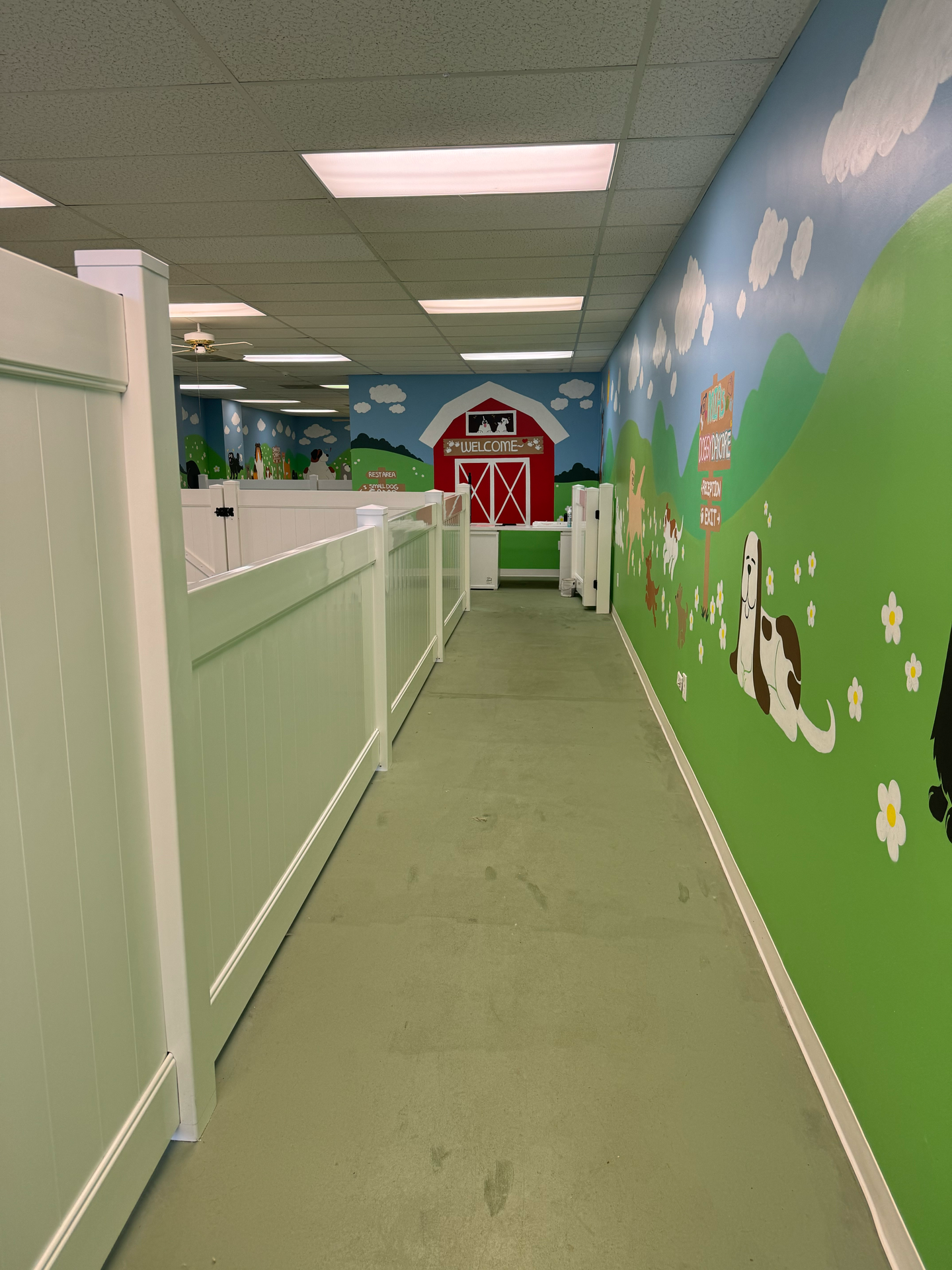 A hallway with a barn painted on the wall