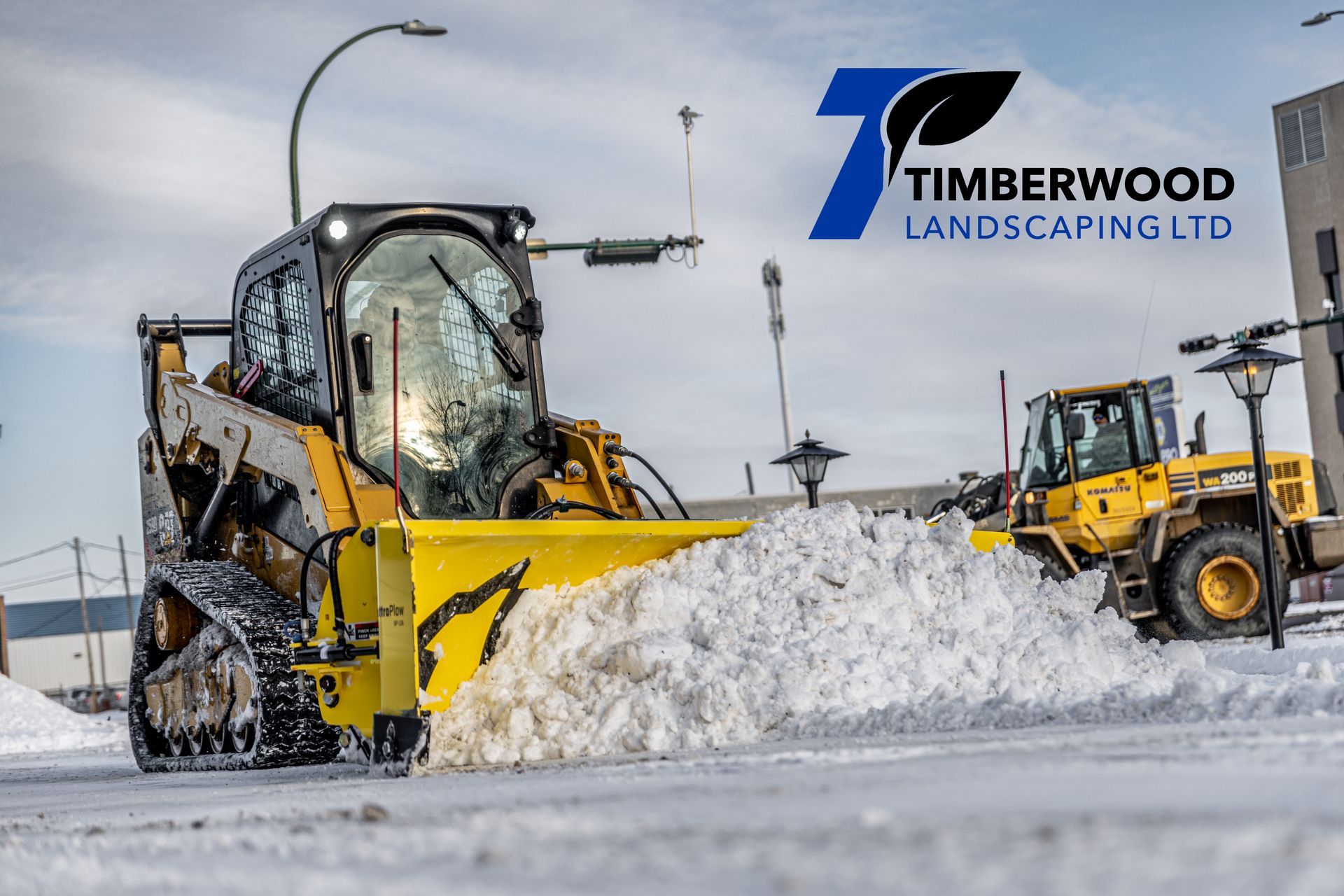 Snowplows removing snows on commercial area