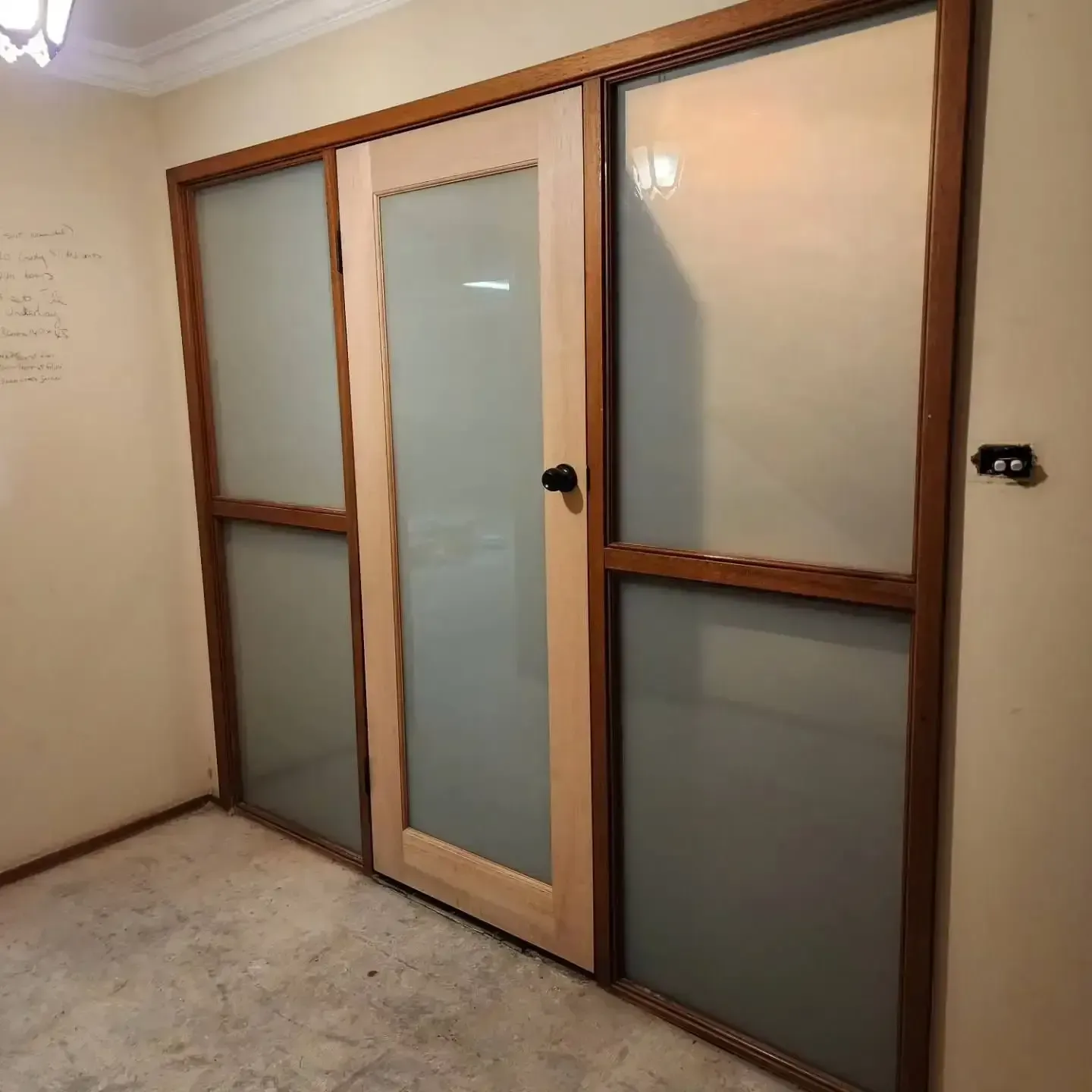 A Room With Sliding Glass Doors And A Light On The Ceiling — Lumba Glass & Glazing In Kincumber, NSW