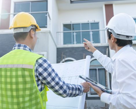 Architect Inspecting House