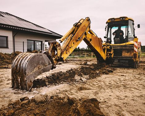 Excavator is Digging in an Empty Land