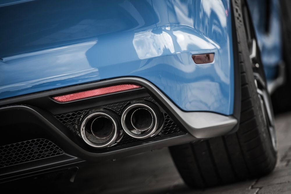 A Close up Of the Exhaust Pipes of A Blue Sports Car — Coastal Mechanical Servicing and Repairs in Wurtulla, QLD