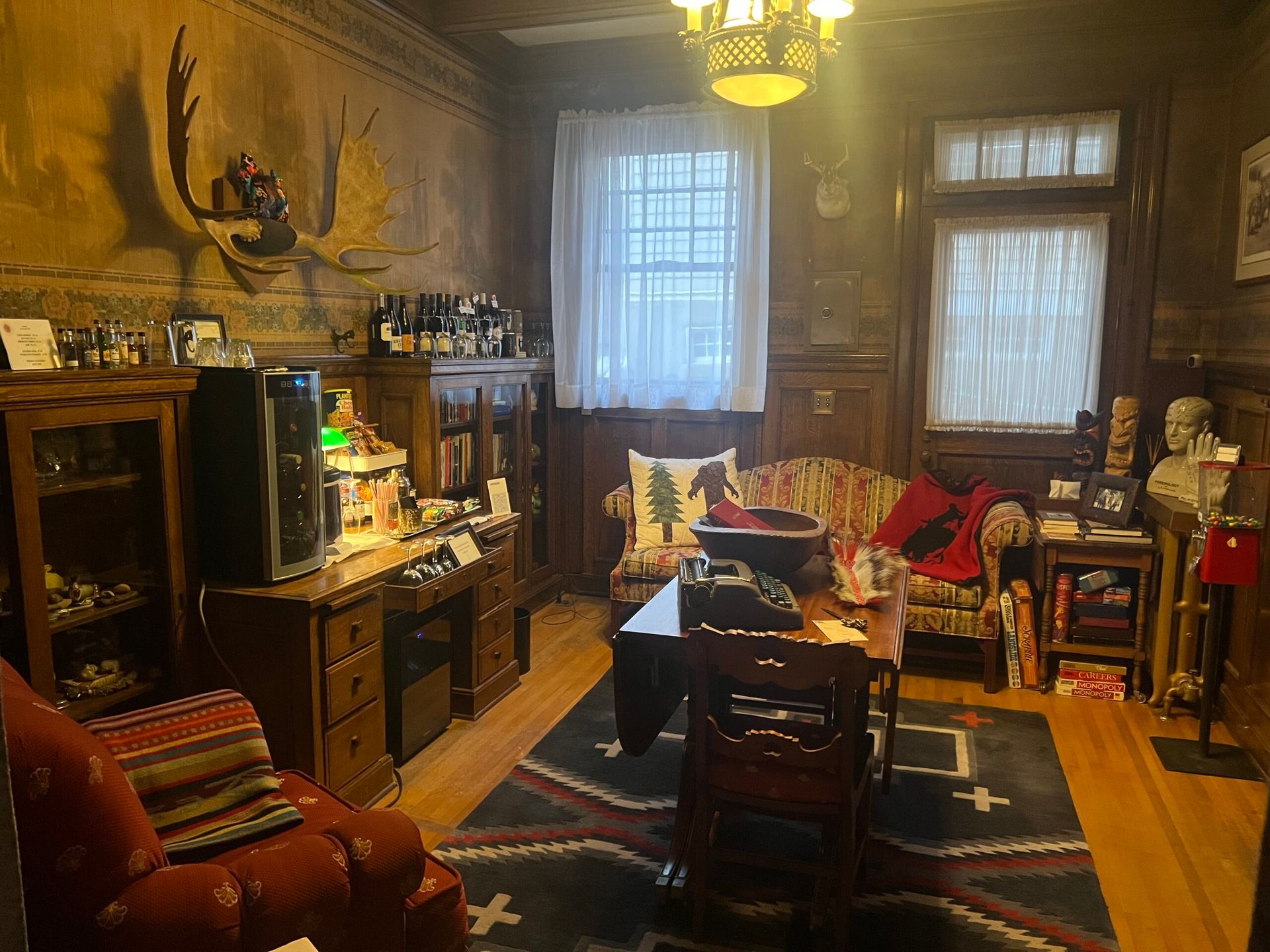 A living room with a couch and chairs in it