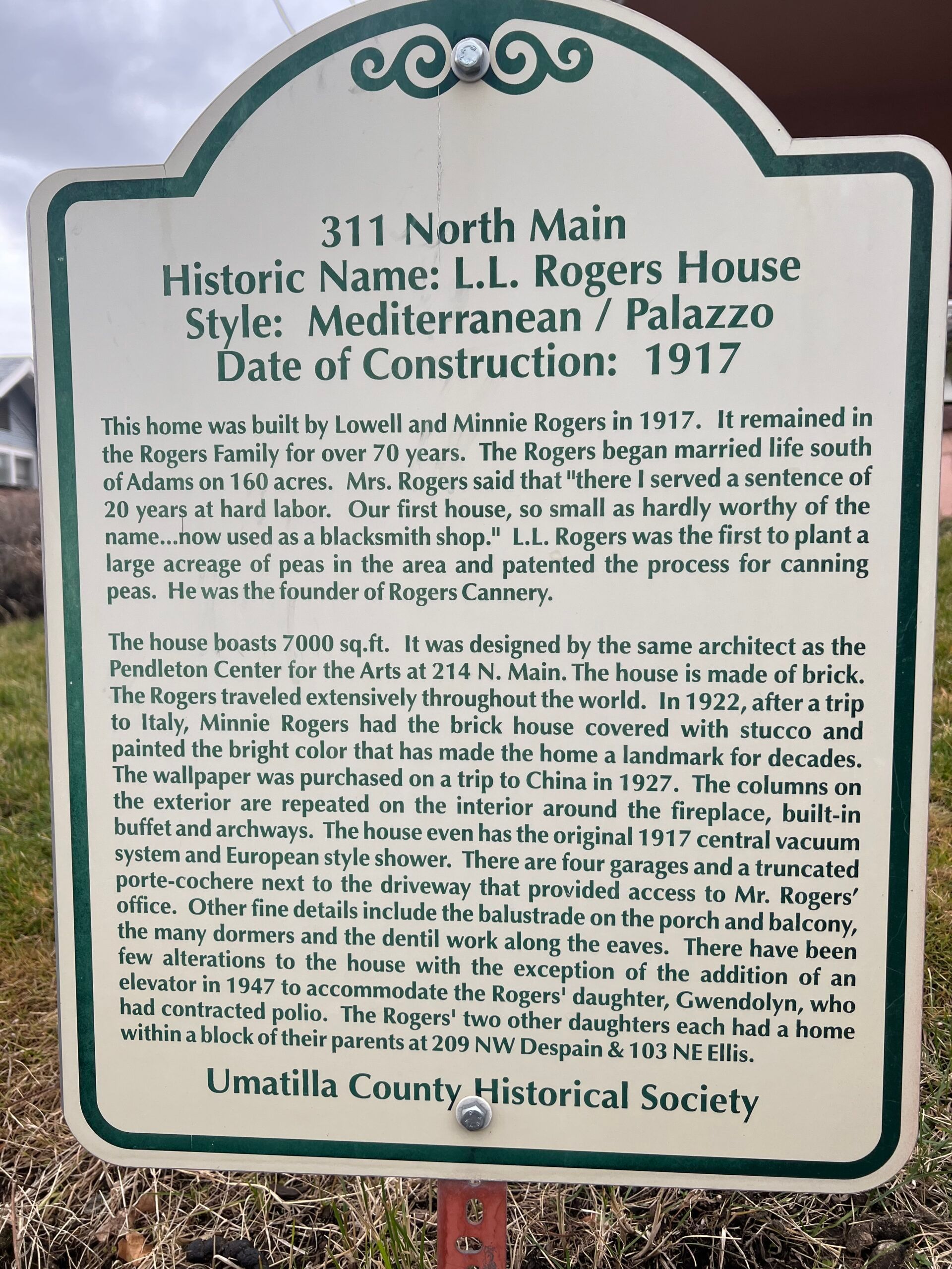 A sign that says 311 north main historic name ll rogers house style mediterranean palazzo date of construction 1917