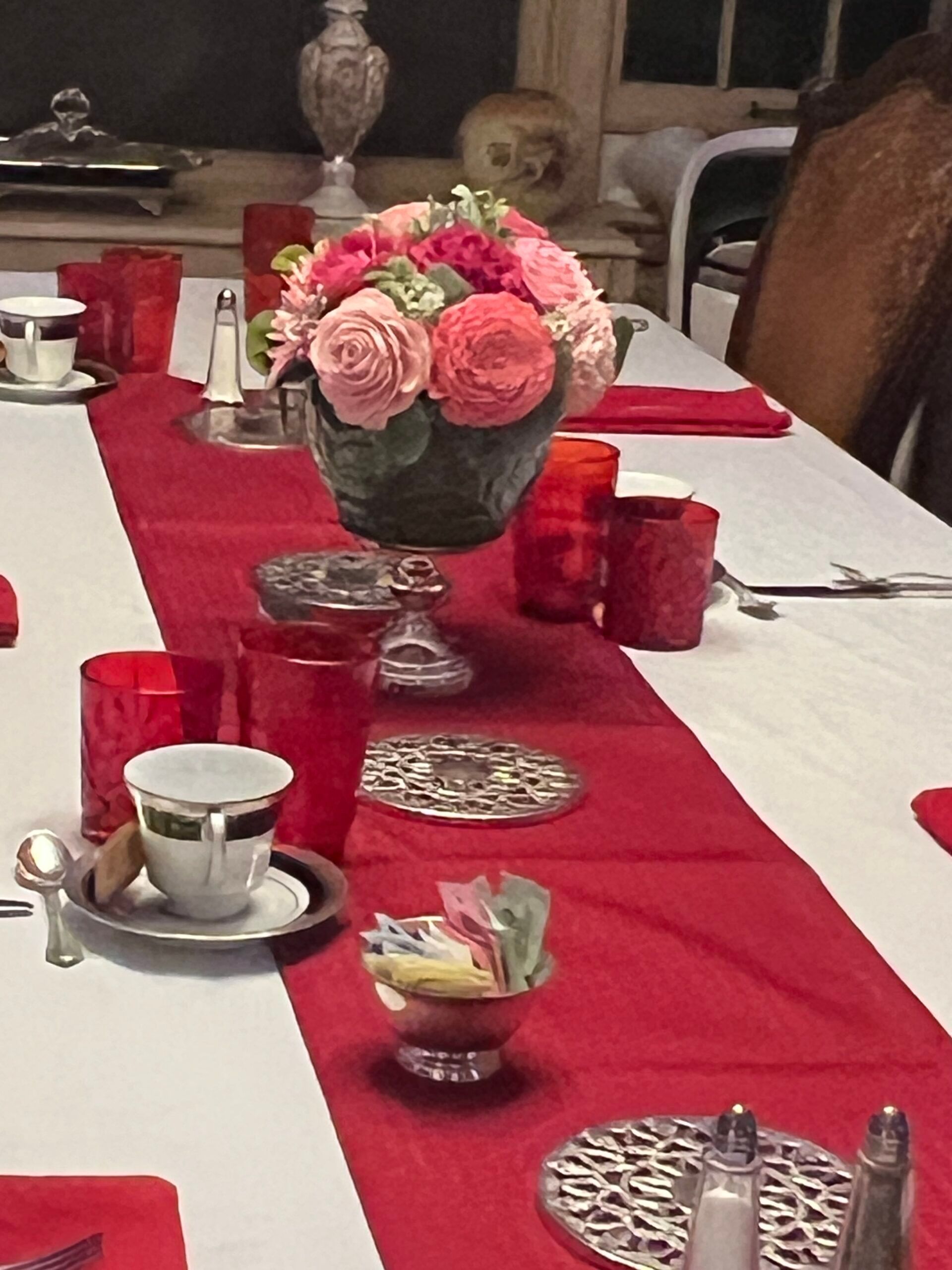 A table with a vase of flowers on it