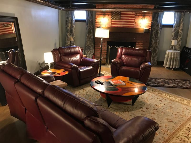 A living room filled with furniture and a fireplace