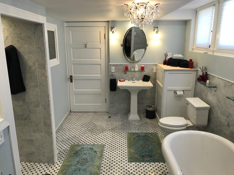 A bathroom with a sink a toilet and a bathtub