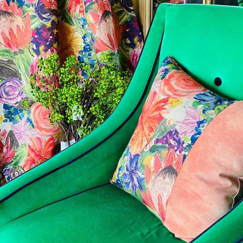 Green sofa with pink pillow — Homeware provider in Tamworth, NSW