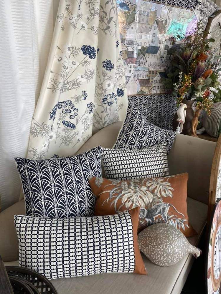 A Couch With a Lot of Pillows on It in a Living Room — Tamworth Interiors in Armidale, NSW