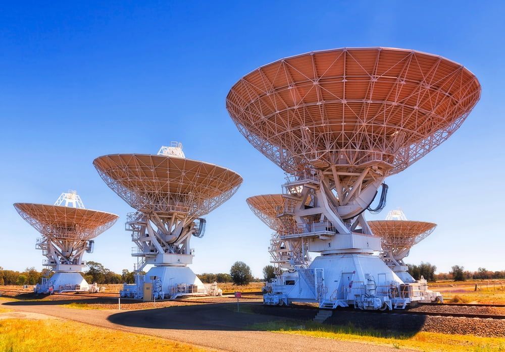 Three Large Satellite Dishes Are Sitting on Top of Each Other in a Field — Tamworth Interiors in Narrabri, NSW