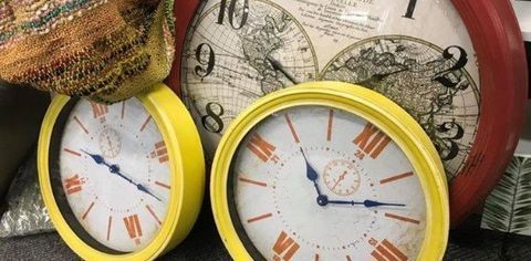 Two yellow clocks and a map — Tamworth Interiors in Tamworth, NSW