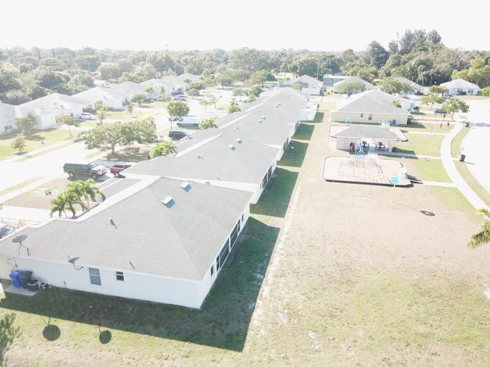 An aerial view of a row of houses in a residential area