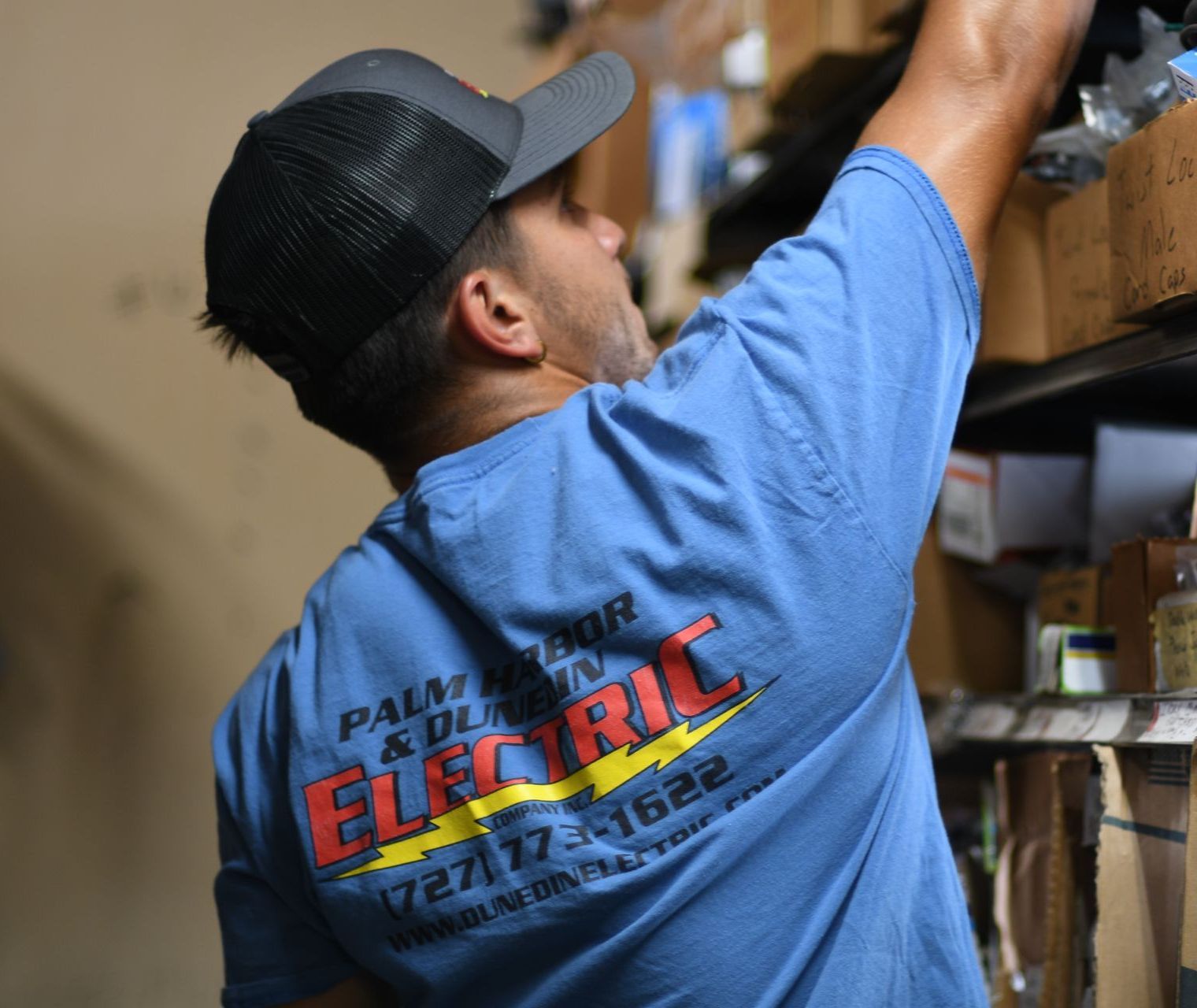 Man Installing Bulb — Clearwater, FL — Dunedin Electric