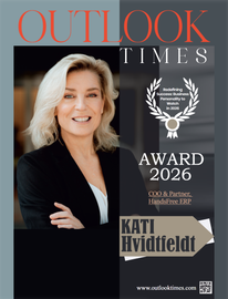 Magazine cover: Kati Hvidtfeldt, smiling blonde, in black blazer. Text