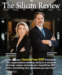 Two executives in dark suits stand arms crossed in a magazine cover portrait.