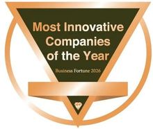 Certificate for Kati Hvidtfeldt, Chief Operating Officer. Gold accents on black background. Photo of woman.