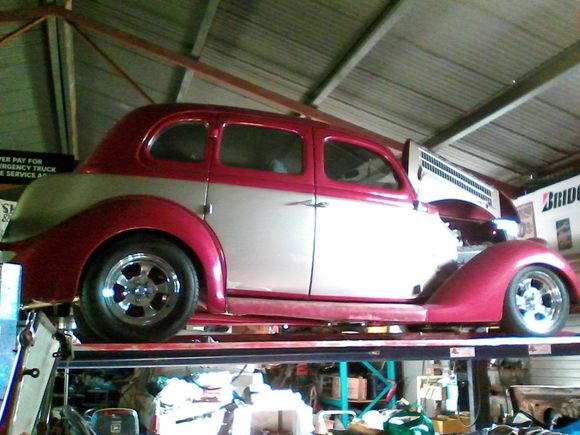 Red car being repaired
