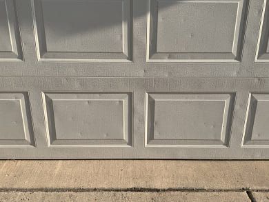 Hail damage on garage door