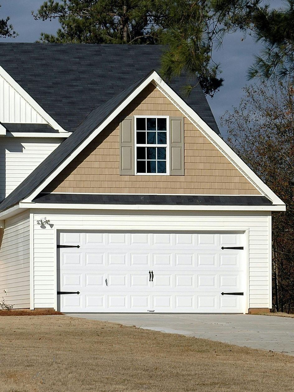 Metal bracket with holes and two circular attachment points.