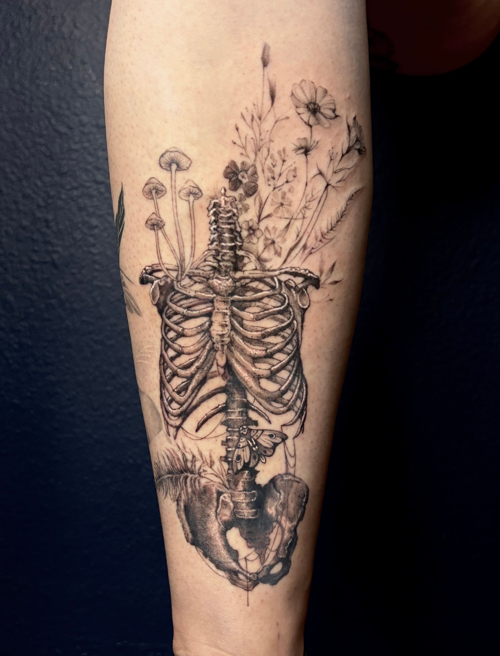 Two koi fish tattoo in black ink on an arm.