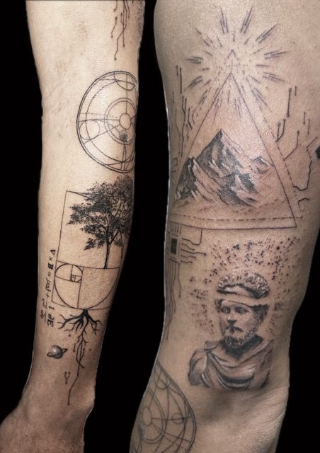 Tattoos on arm and leg. Geometric shapes, mountain, tree, bust, and swirling lines are present.