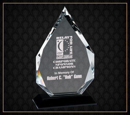 A diamond shaped crystal plaque that says relay for life