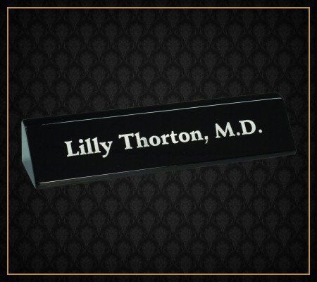 A black name plate for lilly thorton m.d.