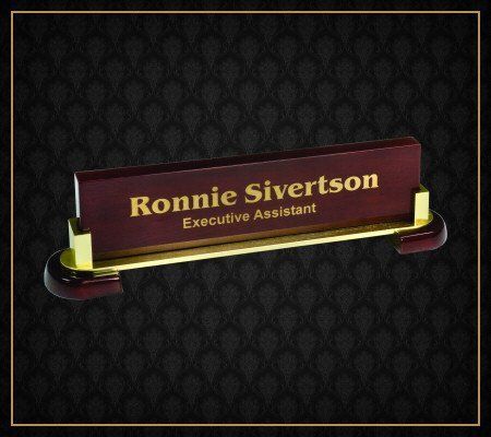 A wooden name plate for ronnie sivertson executive assistant