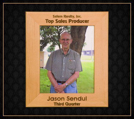 A framed picture of a man named jason sendul