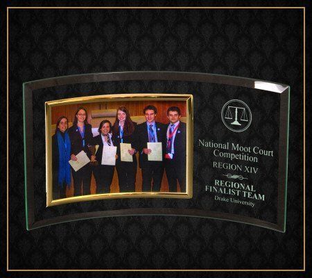 A glass plaque with a picture of the regional finalist team