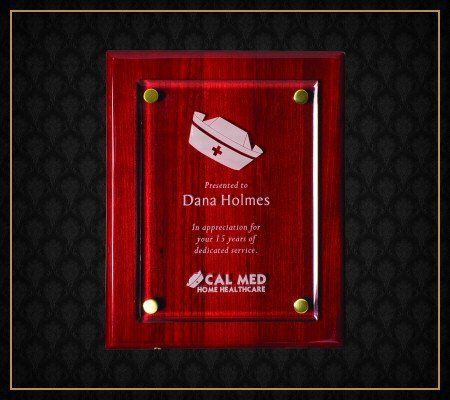 A wooden plaque with dana holmes written on it