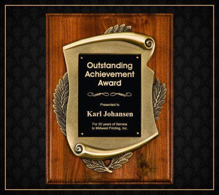 A plaque that says outstanding achievement award on it
