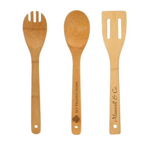 Three wooden utensils including a fork spoon and spatula