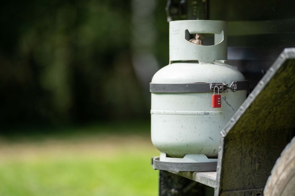 Interior of a Tiny Home With a Ladder to a Loft, Kitchenette, and a Sofa — D & E Milner Plumbing In The Palms, QLD