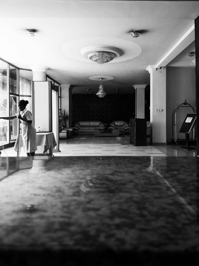 A black and white photo of a hotel lobby