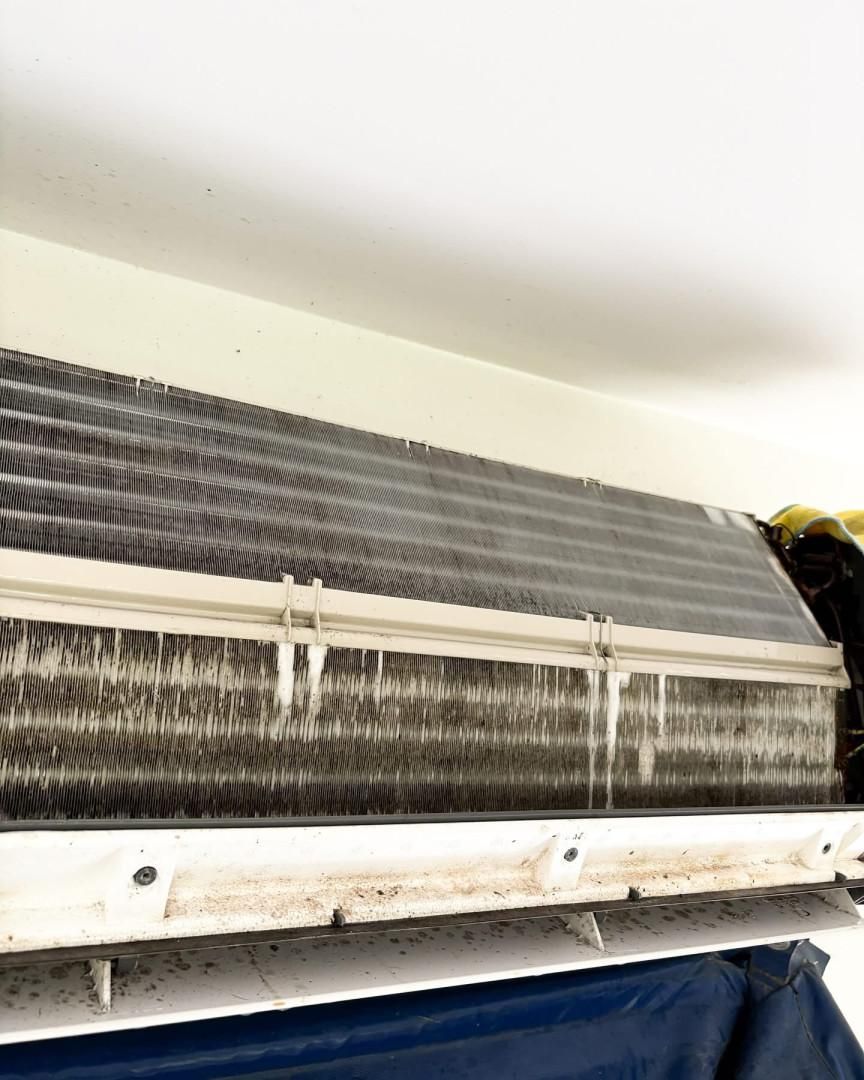 A Close up Of a Dirty Air Conditioner Hanging from The Ceiling — Staub Air in Garbutt, QLD