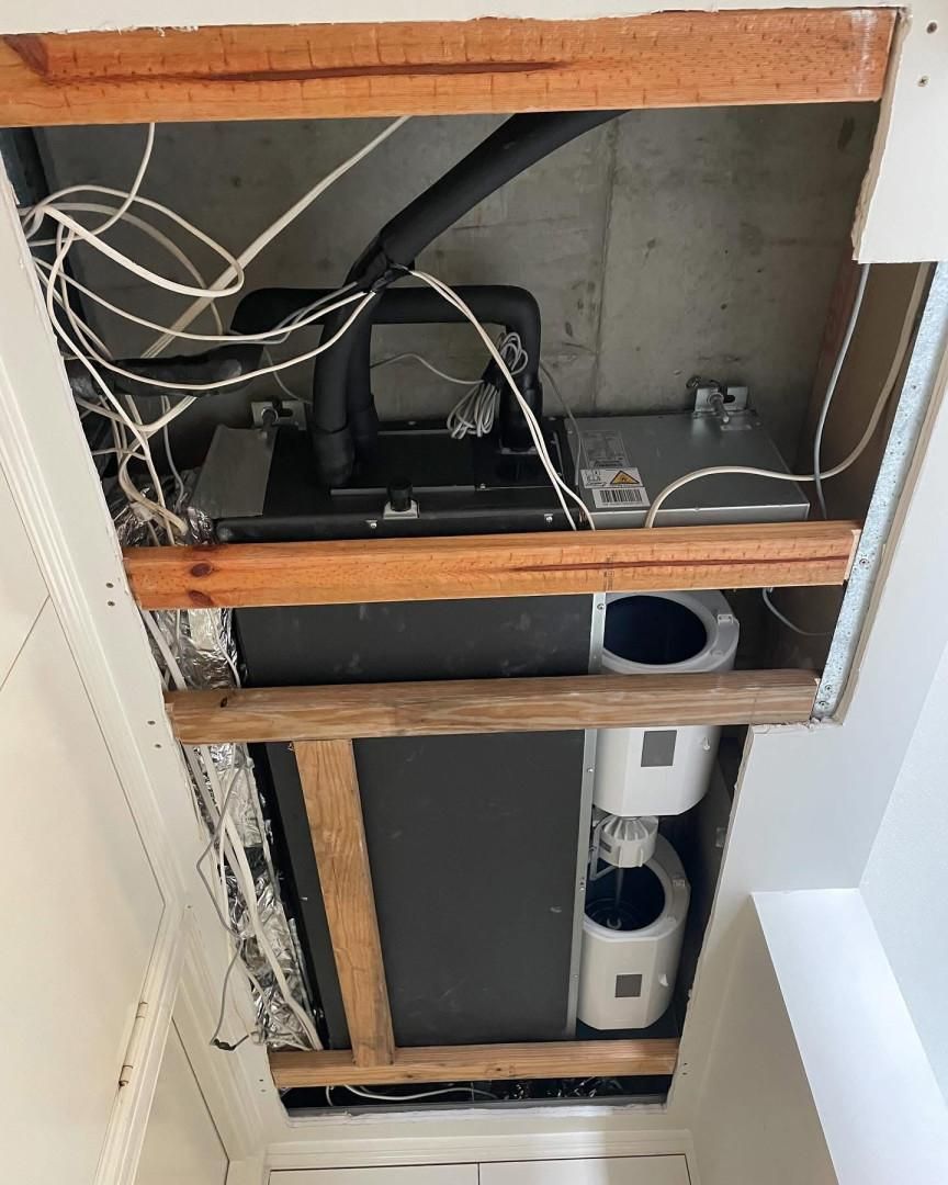 A Ceiling with A Lot of Wires Coming out Of It — Staub Air in Garbutt, QLD