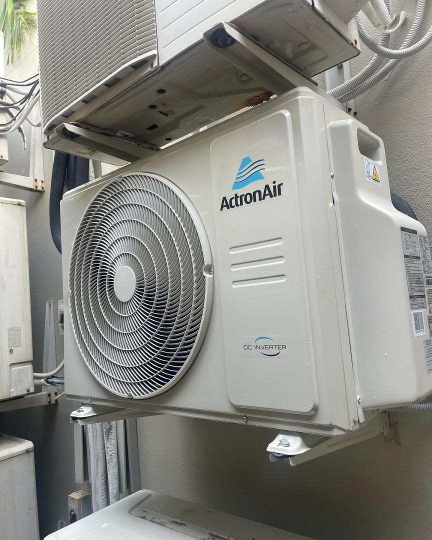 A White Air Conditioner with The Word Astron Air on It — Staub Air in Garbutt, QLD