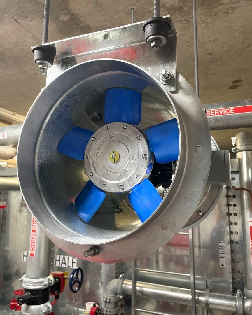 A Fan with Blue Blades Is Hanging from The Ceiling in A Room — Staub Air in Garbutt, QLD