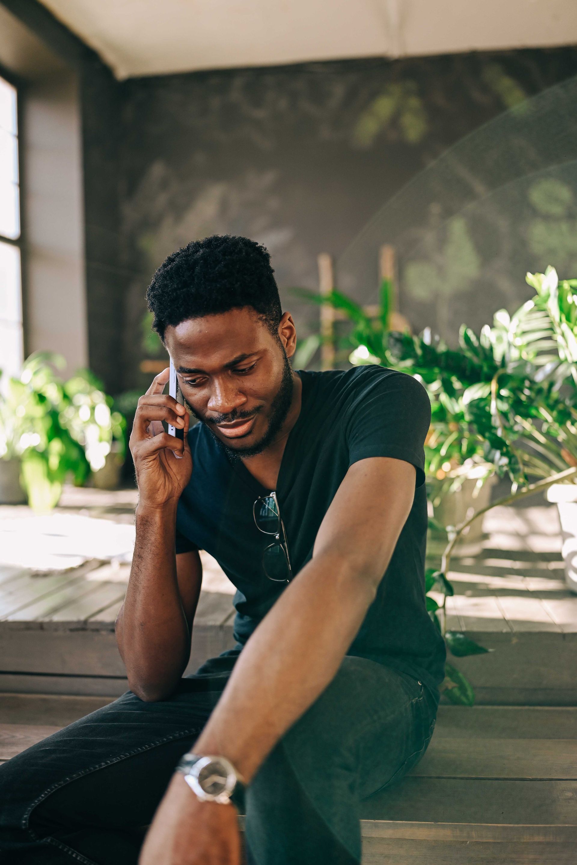Couple in therapy session, discussing with therapist in a well-lit office.