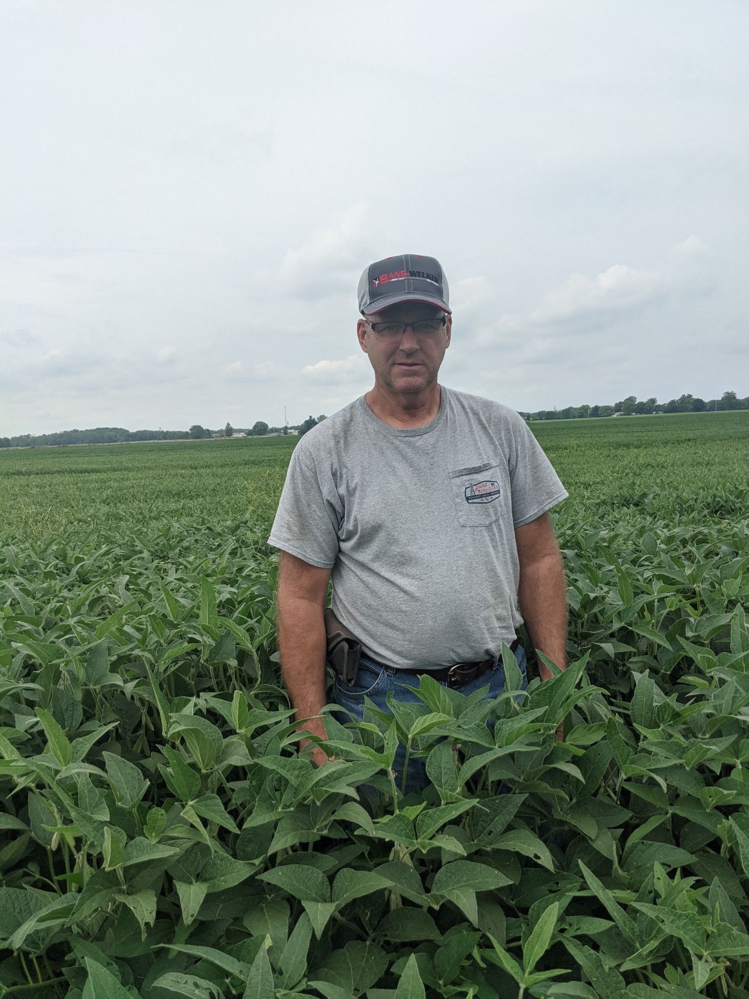 Tri-Ag customer, Glen Miller, in his green soybean field.