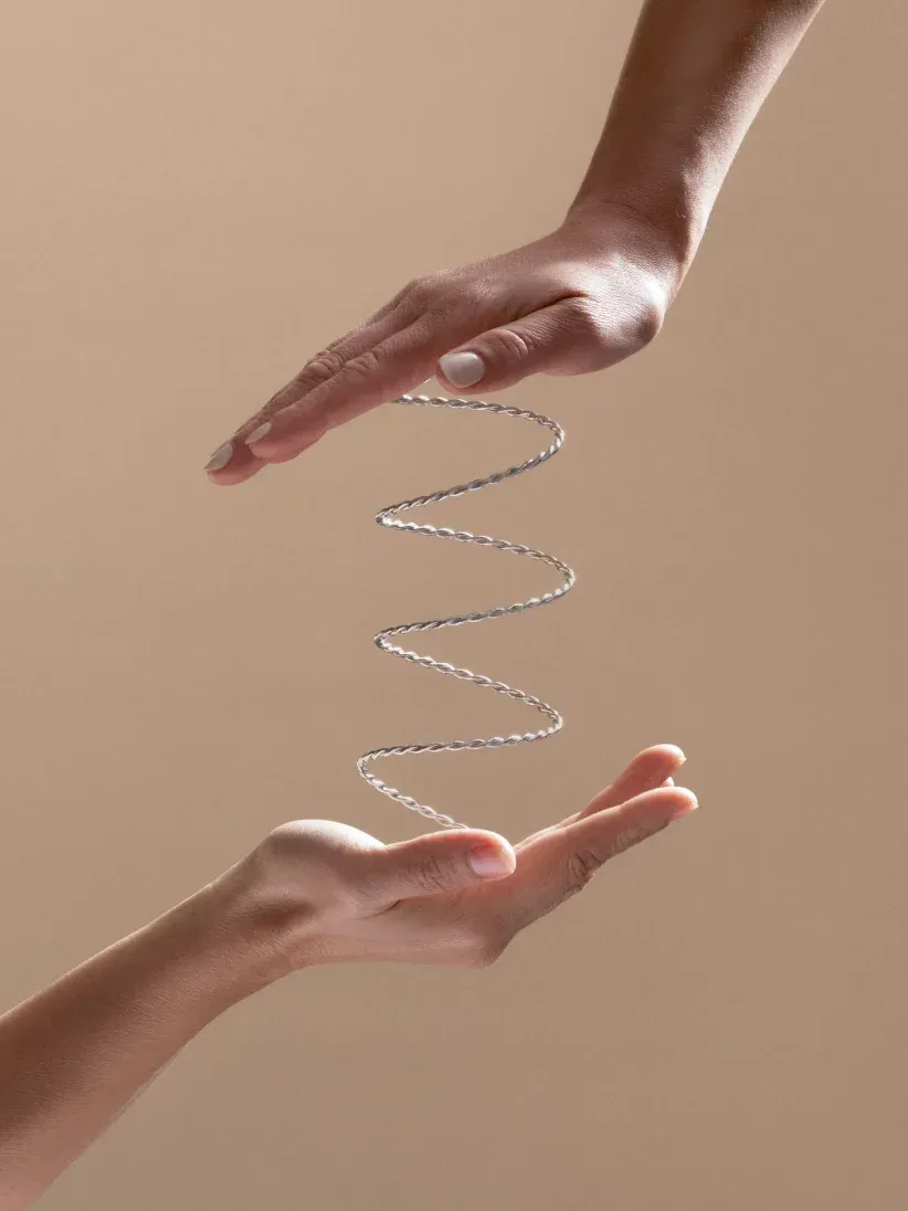 A person is holding a spiral in their hands.