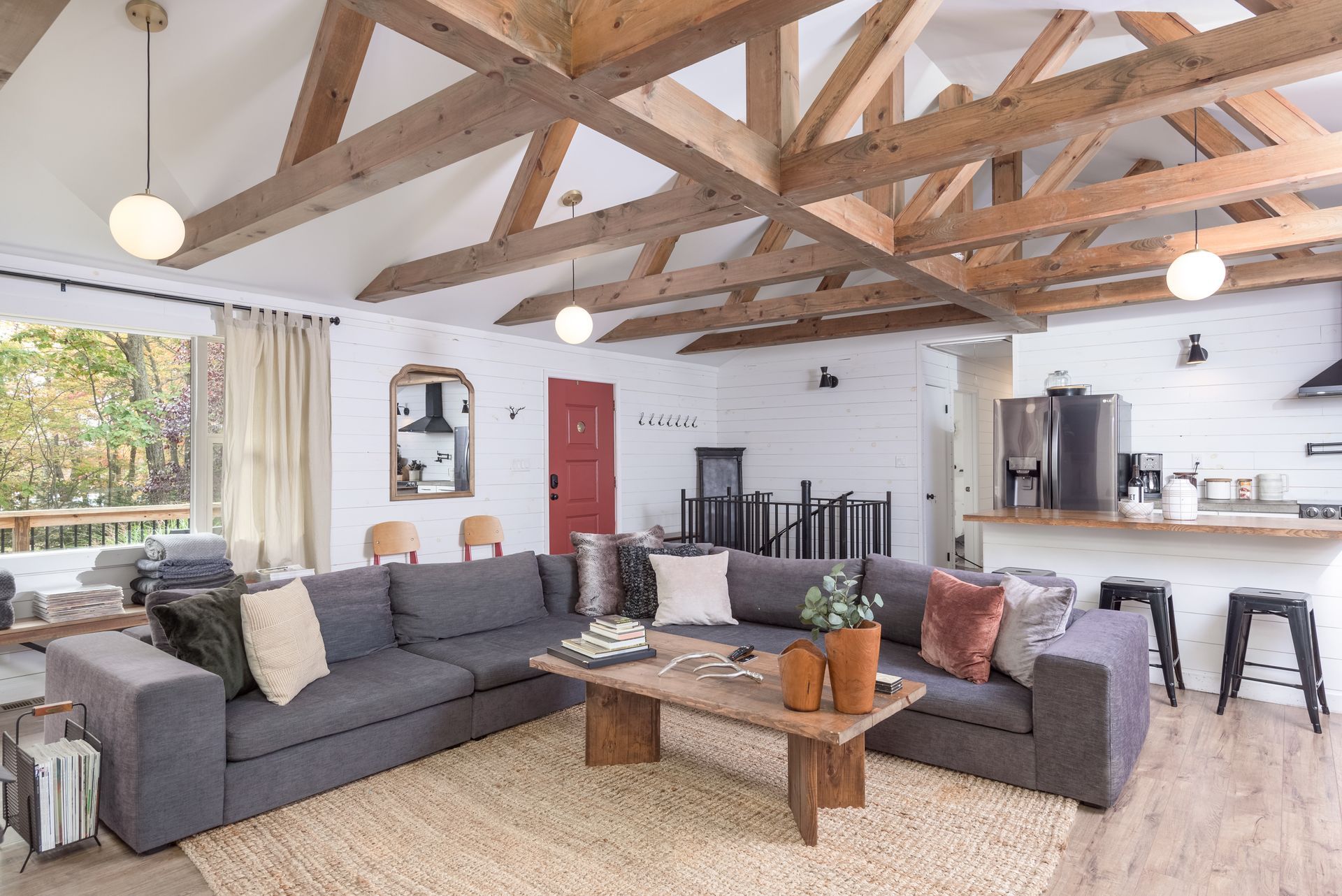 A living room with a large couch and a coffee table.