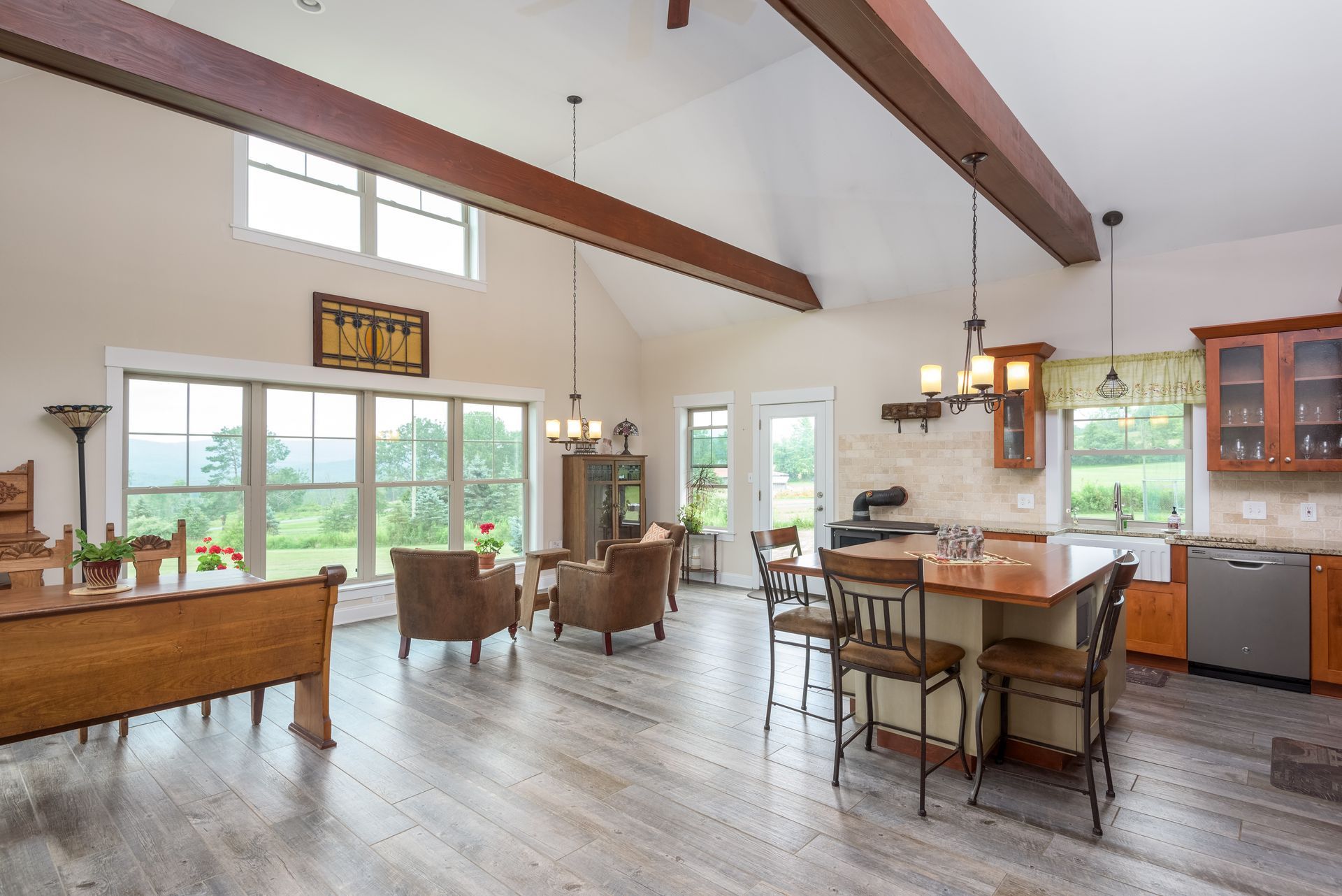 A large living room with a kitchen and dining area