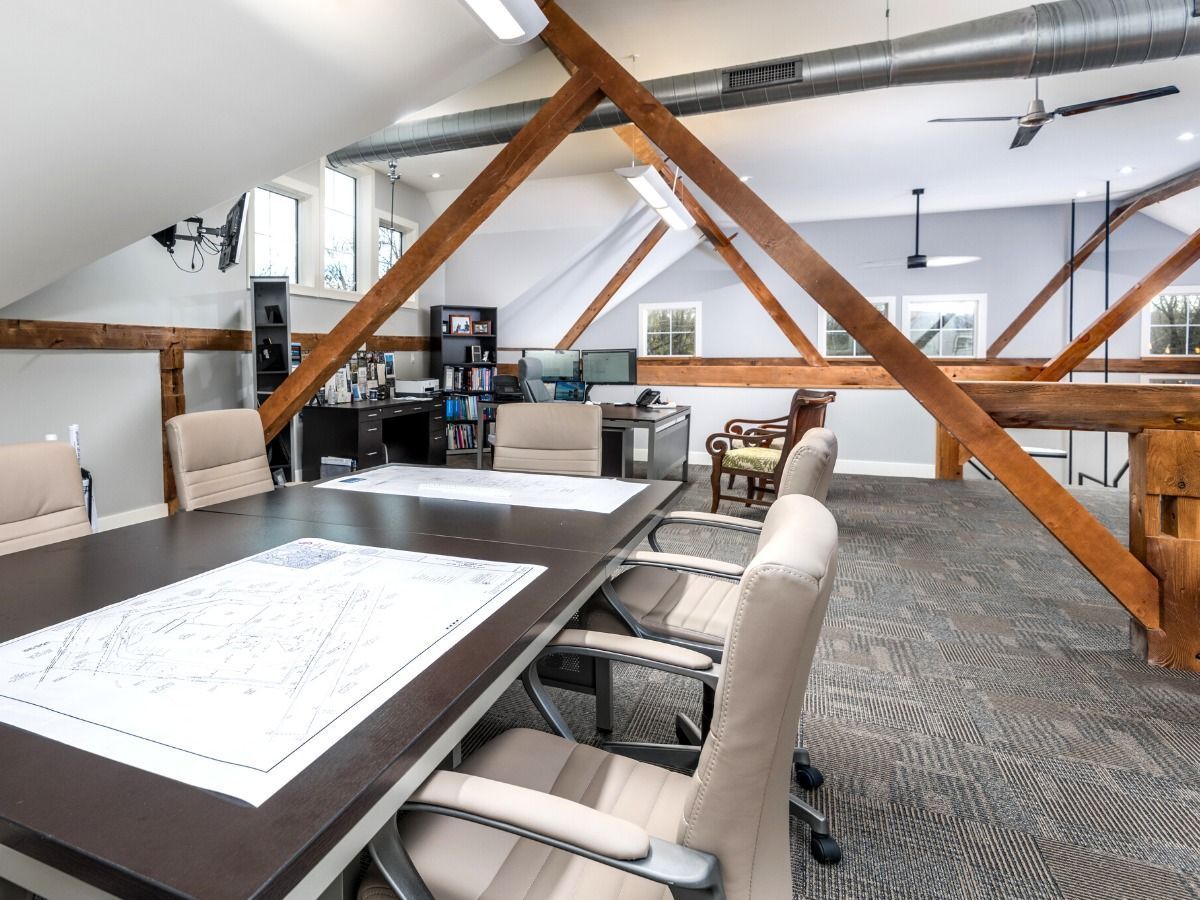 A conference room with a long table and chairs