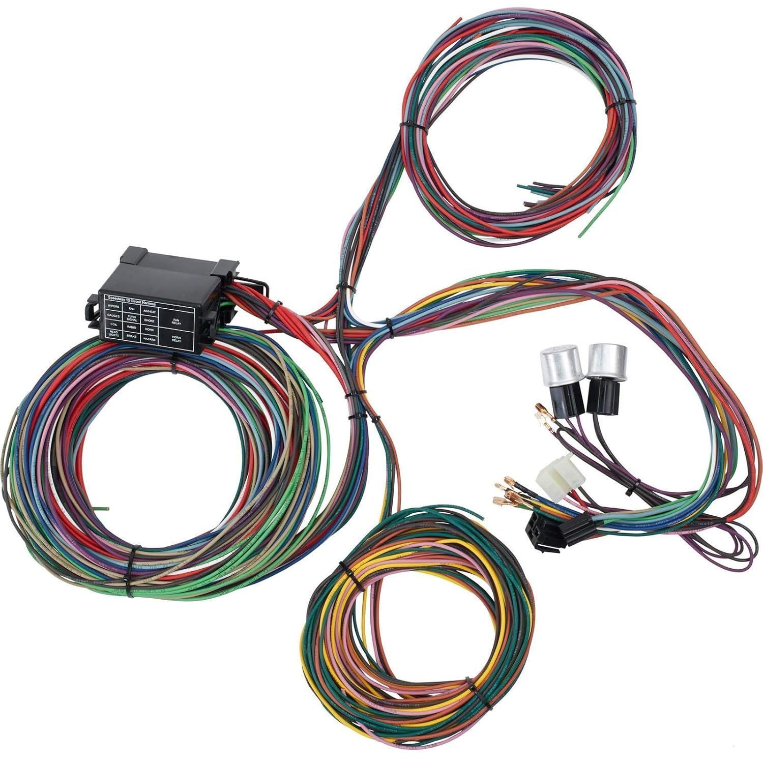 A universal automotive wiring harness kit with a central fuse block and multi-colored wires coiled into three bundles.